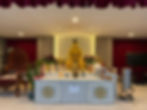 Eye-level view of a serene meditation hall with cushions arranged neatly